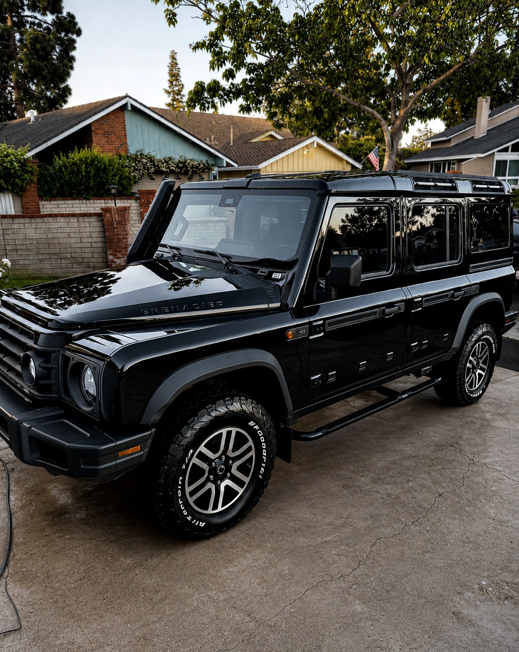 Detailed gloss-black Ineos Grenadier in an Orange County driveway
